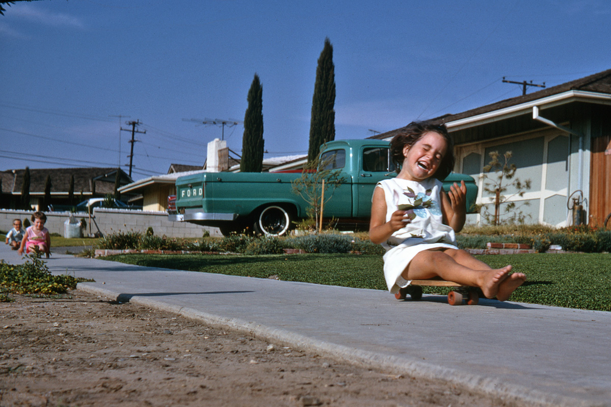 Diamond Bar, California, July 1968. My niece Mary having a good time, apparently. Neighbor has a nice early-60s Ford pickup. I shot this on 35mm Kodachrome. View full size.