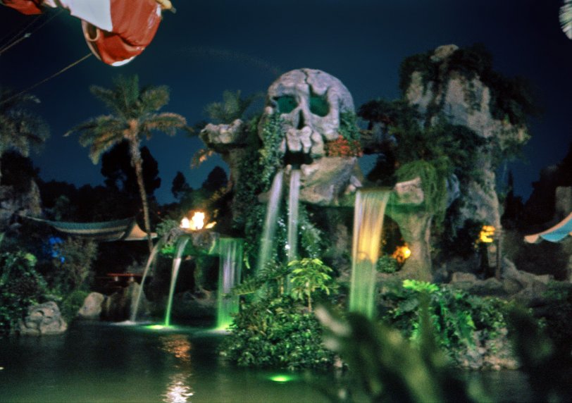 In my last two shots, we saw the bright, sunny, carefree, Happiest Place on Earth Disneyland. Who knew there was also the dark, horrific, bloodcurdling Disneyland? Well, not tterrace. Skull Rock Lagoon was perfectly designed to stimulate the "Wow, cool!" gland in the 17-year-old me. (Translation for today's ears: "Awesome!") Added in 1961 to provide a new backdrop for Captain Hook's splendiferous Pirate Ship (which housed the Chicken of the Sea Restaurant), Skull Rock was particularly creepy-cool at night, when I took this time-exposure Ektachrome in 1963. Alas, the ship, lagoon and Skull Rock were all removed and in 1983 the Dumbo Flying Elephant ride took the spot. View full size.

