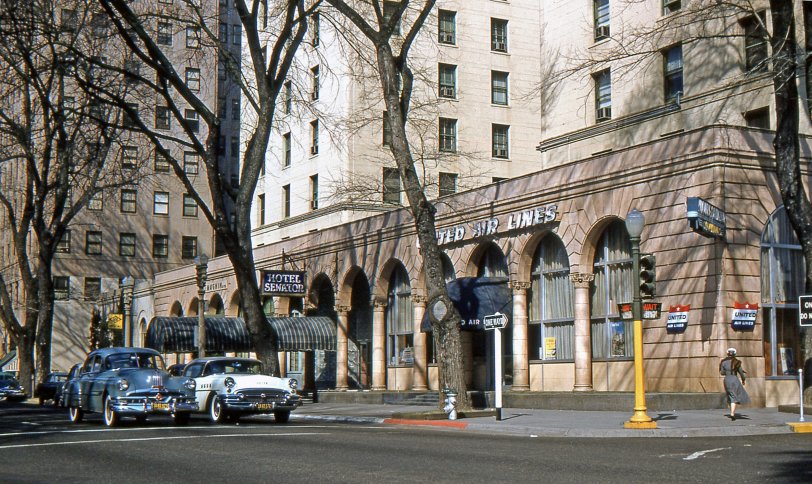 The Hotel Senator, at 12th and L in Sacramento, circa 1955. Just by chance, this picture includes a well dressed young woman wearing a genuine fur stole.  Those things were made of the pelts of several little animals stitched together. They were taxidermied and had beady little eyes.  One of them had an alligator clip type mouth so that the stole could be fastened around the shoulders. View full size.
