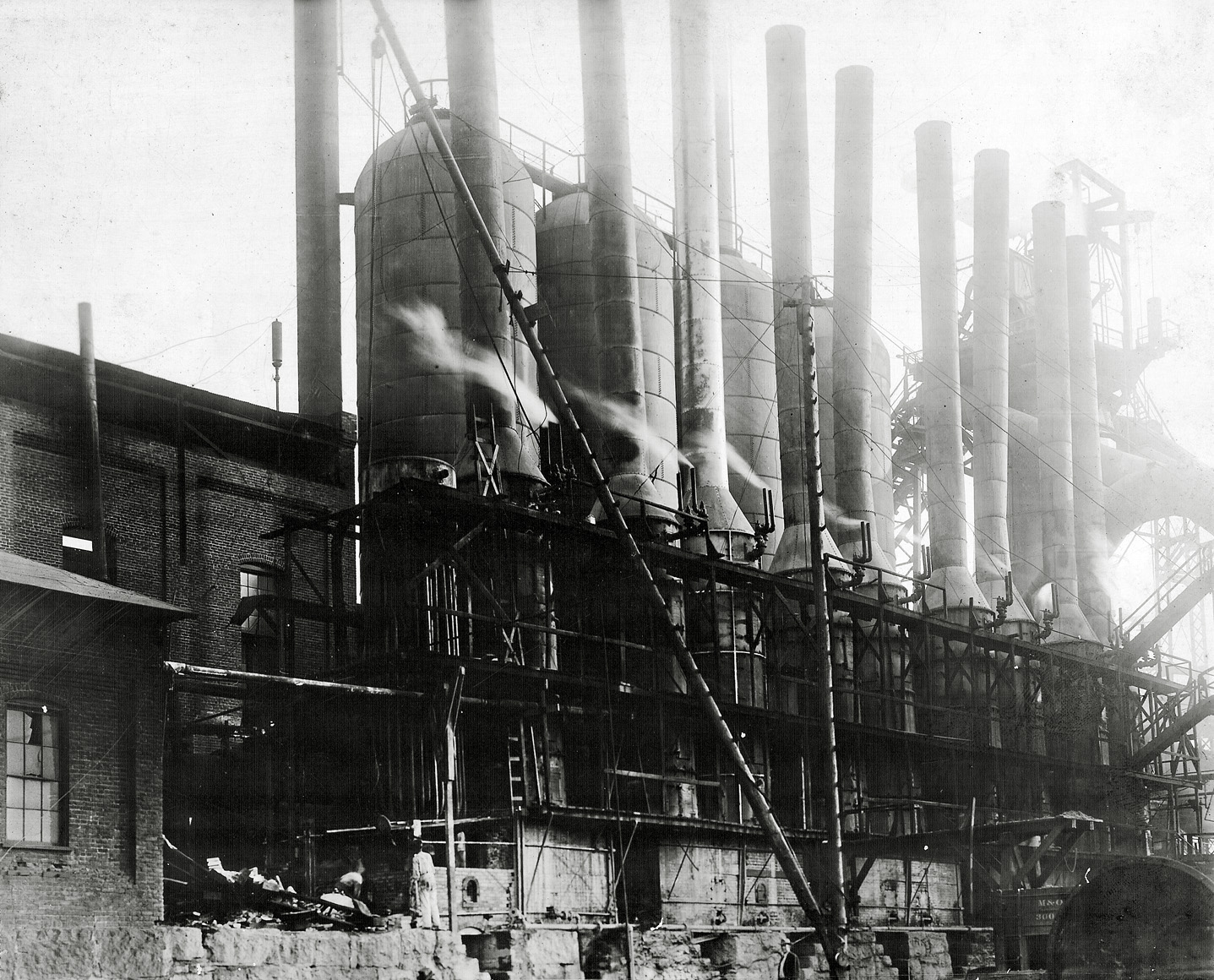 I purchased this framed photo at an estate sale in Birmingham. This image looks like it may be Sloss Furnace, now a Birmingham historic site, at the turn of the century. View full size.