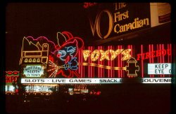 On a road trip in 1977 I visited Las Vegas and stayed for one night. I don't gamble, so I took Kodachrome slides of the incredible neon signs and watched the passing parade of people. This sign was all in motion, with sequencing lights making the fire hose appear to be spraying water to cool down the overheated slot machines.
