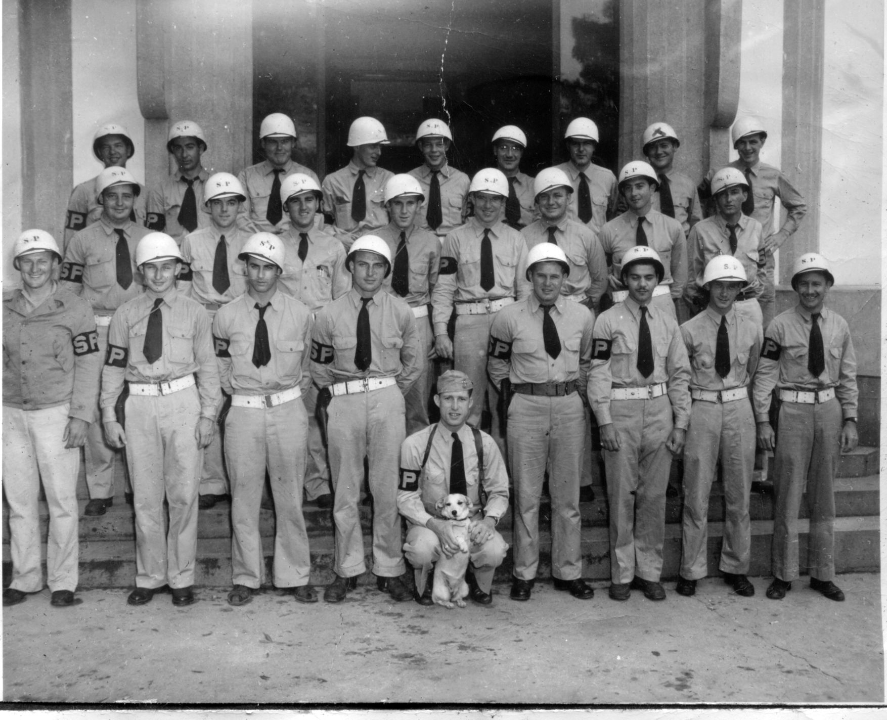 My grandmother's brother Francis Webb is 3rd from the right, middle row in this picture. They are wearing bands that say SP, not sure if this stood for Staff Police, but I am thinking it's some kind of military police group. View full size.