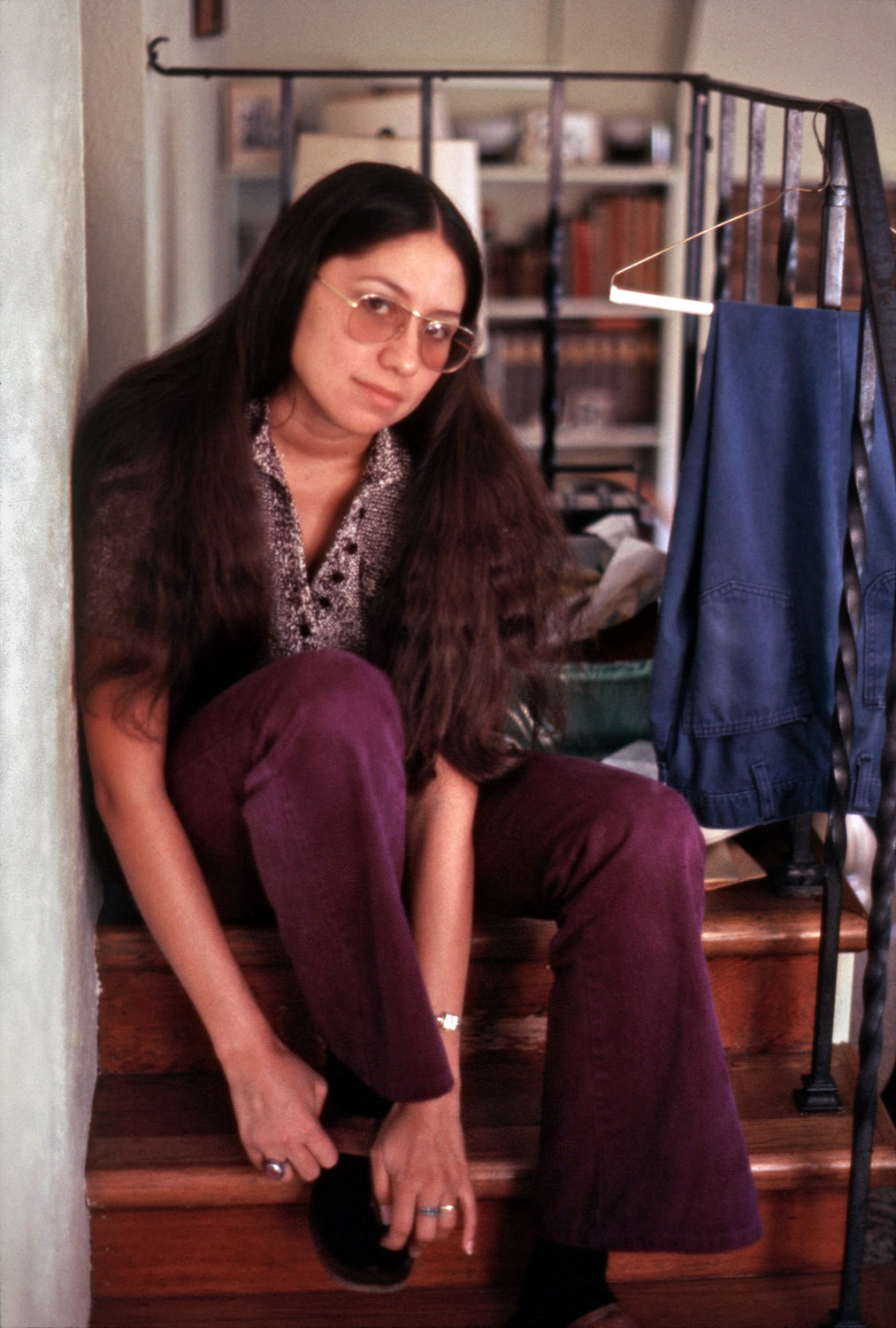 My sister-in-law in the living room of my folks' Larkspur, California home. The stairs lead up to the bedrooms on the second floor, in one of which I was still domiciled, hence the freshly laundered pair of pants my mother has conveniently placed for my retrieval. My Ektachrome slide. View full size.
