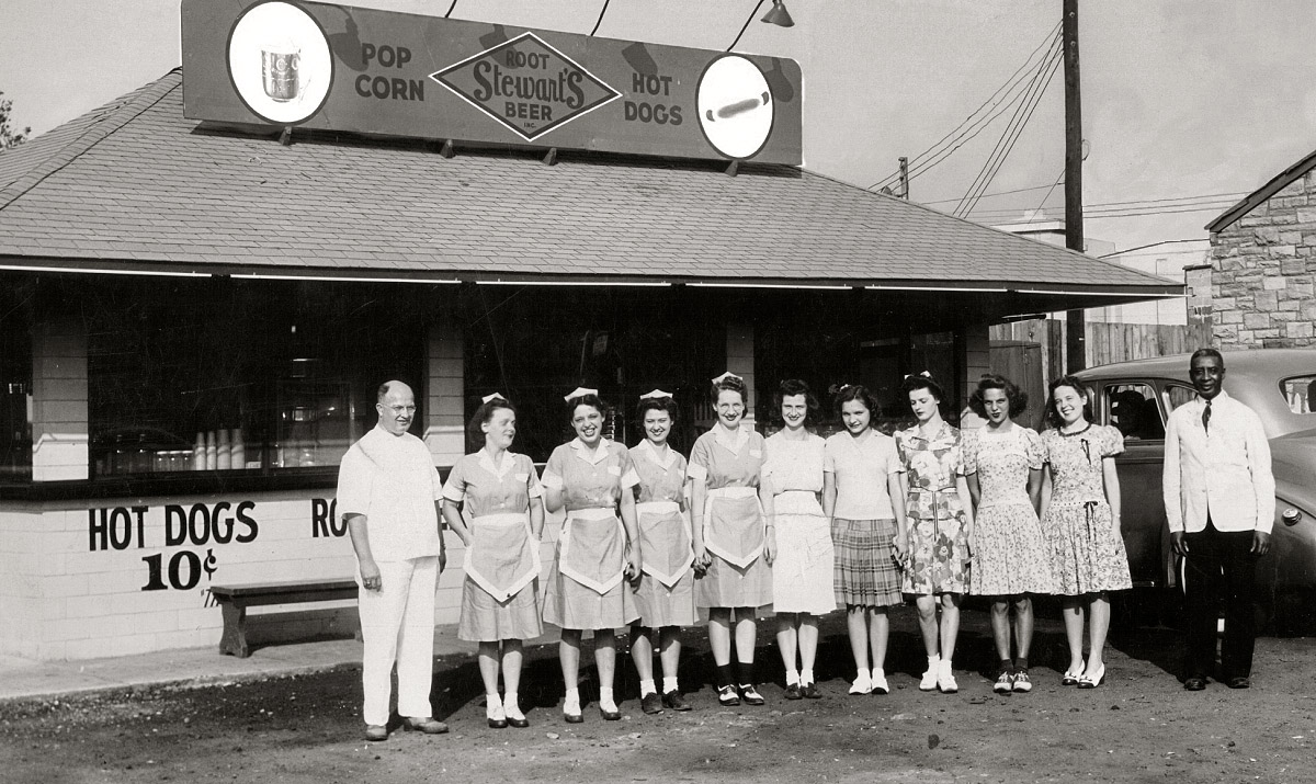 Stewart's Root Beer stand on Kanawha Boulevard in Charleston, West Virginia. Fifth girl from the left is my Aunt Doris at 15 years of age. This drive-in was very popular in its day.  Later a Shoney's would be built here, and then a Captain D's. View full size.