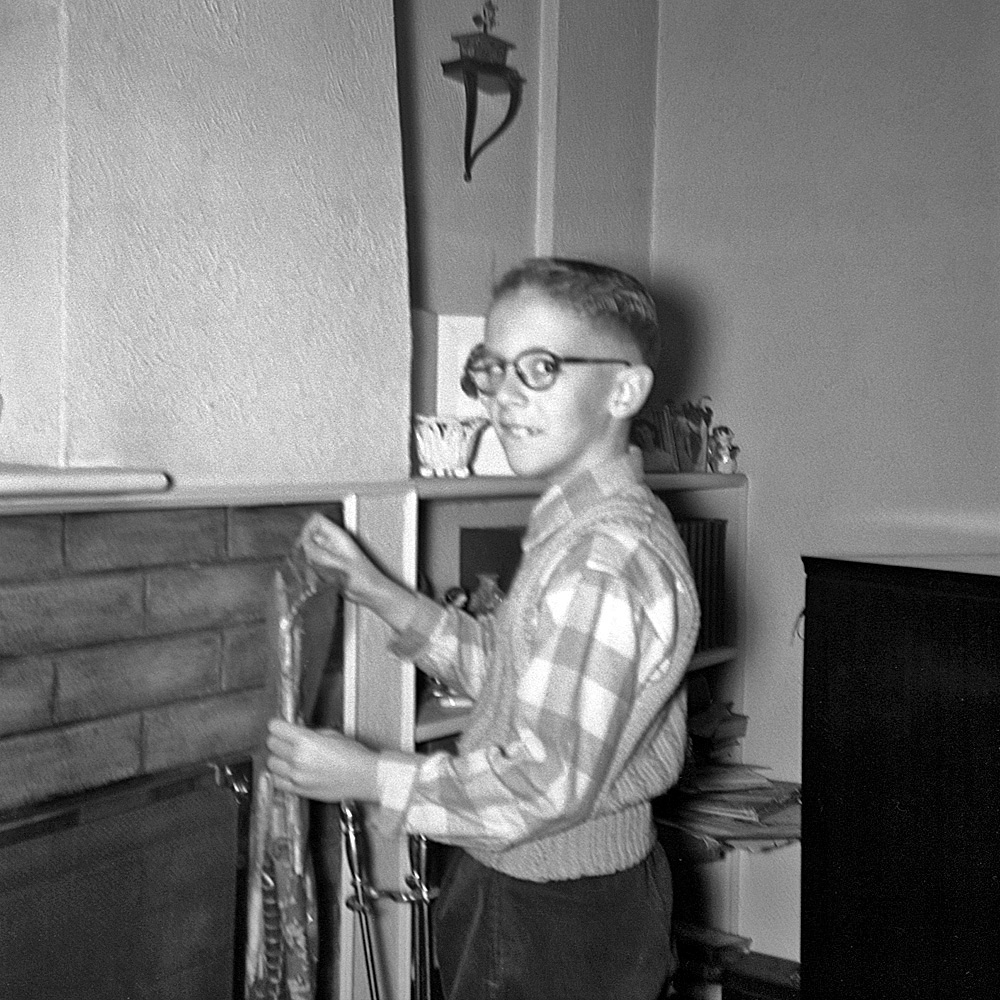 December 24, 1954. The only explanation I can come up with for my disturbing expression is that this was the same year my brother took me to see Rear Window. But, since it's the only one of me hanging my Christmas stocking (or of anybody in our family hanging one), I'm stuck with it. And my brother jiggled the camera. Funny thing is, there's already stuff in the stocking (probably with a tangerine down in the toe, like always). I'm 8 and well past the Santa Claus pretense, so I'm probably just helping with the decor. Anyway, what I'm mainly interested in is all the really good stuff that'll be there the next morning. My favorite thing here is all the junk (undoubtedly mine) exploding out of the shelf behind the TV.

Many thanks to everybody who's said nice things about my photos, and gigantic thanks to Dave not only for Shorpy itself, but for his ever-expert editorial emendations. I've had a ball here. View full size.