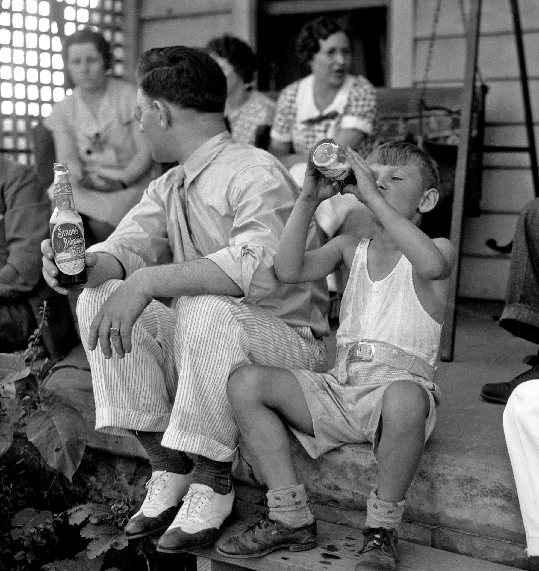Circa 1935 family portrait by my grandfather Howard McGraw, a photographer for the Detroit News for almost 40 years, of his brother and a thirsty young nephew. Scanned from a 4x5 negative. View full size.