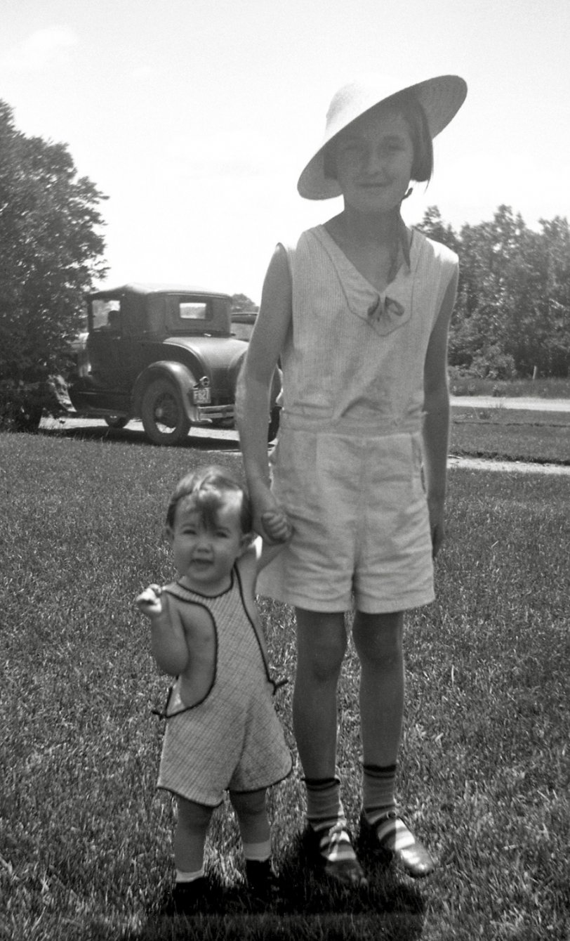 A couple of kids enjoying the fine summer weather, likely in New England. From my negatives collection. View full size.
