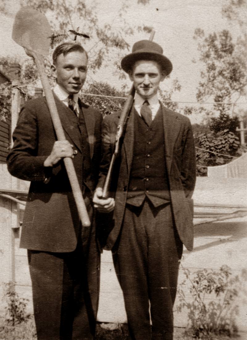 A photo of my great uncle and his friend, taken sometime before 1920. I don't even want to know why they're posing with a shovel and a gun . . . while wearing suits, no less. View full size.