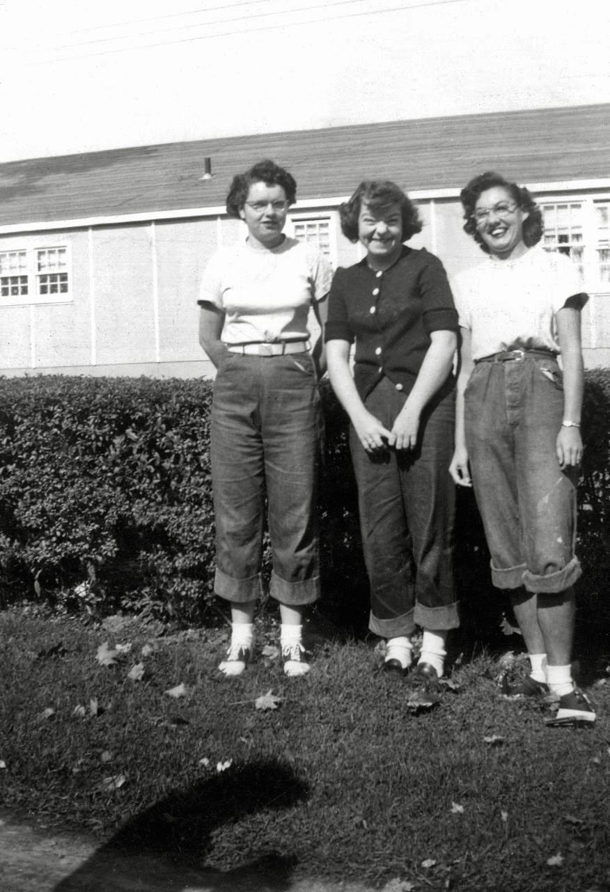 Late 1940's or early 1950's teens with rolled up jeans bobby sox, and a pair of saddle shoes. The caption on its back reads:

&nbsp; &nbsp;  &nbsp;  &nbsp; Rose between two thorns
 &nbsp;  &nbsp;  &nbsp;  &nbsp; Aileen, Doc, and Jackie

I found this snapshot in an antique store in Simi Valley, California. View full size.