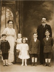 My Grandparents, John and Helen Wolak, shown here in this circa 1921 photo taken in Buffalo, New York, with their five children (L to R), Bill, Stanley, Jenny, Marcel, and Adam(my Father). John and Helen arrived at Ellis Island in 1911 from Poland, lived briefly near Scranton, Pennsylvania, and in western New York, before settling permanently in New Britain, Connecticut in the 1920s. View full size.
American DreamWhat a handsome family. I'm curious as to what your grandfather did for a living. They look rather prosperous. But then that's why he came to America - to achieve the American Dream.
(ShorpyBlog, Member Gallery)
