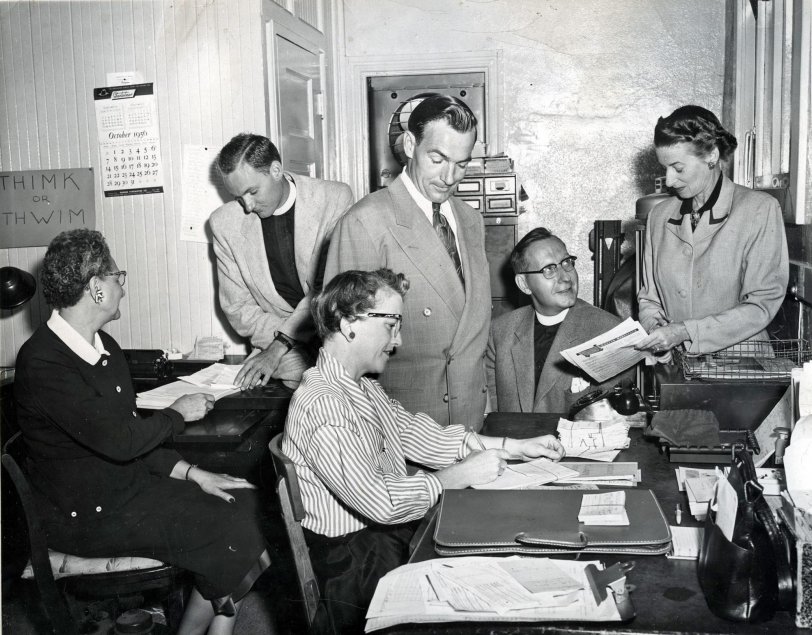 October 1956. From an 8x10 glossy photograph. "Old office in small church. Staff of St Luke's. L to R, Mabel Getchell, Rev. John Sanford, Elmer Nigg (Sexton), Rev. Morton Kelsey, Bernice Pursel, and Virginia Speer (in front). 1956"
This was St Lukes in Monrovia CA.
