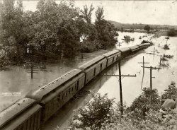 Big River, between Hematite and Victoria, Jefferson Country. Missouri. Stayed out of its banks too long, and roadbed failure followed. Local photographer sold these pictures to locals. "June 10, 1938" stamped on the back.