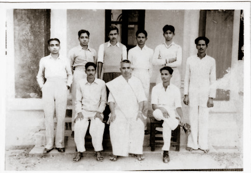 This is a rare photo from the point of view of literary aspect! shri. H. R. Ramakrishna rao (Later he became The Professor of Physics, at the Christ College, Bengaluru) was studying at The Central College, Bengaluru, in 1957 (around). Among the persons sitting: 'Pro. G. P. Rajaratnam' is  sitting in the center. (Pro. Rajaratnam was a renowned respected professor who has written several novels of immense literary value. He is very much known for his Children's story books. Prof. G.P.Rajaratnam  was very much fond of Shri. H. R. Ramakrishna rao, as a student.

'Prabuddha karnataka'("ಪ್ರಬುದ್ಧ ಕರ್ನಾಟಕ ಕನ್ನಡ ಪತ್ರಿಕೆ") was the college magazine, used to be brought out by the 'Central College kannada sangha'. Ramakrishna rao was elected as the secretary for the karnataka sangha, which was considered as highly prestigious, to this day. 'Pro. V. Sitharamayya', was one of the eminent members of that sangha.(Not in the picture) Prof. H.R.R.Rao (89) expired on 12th, Sept, 2022, at his Bengaluru residence.