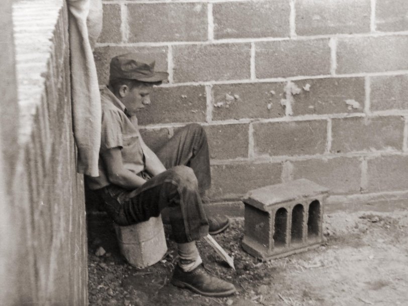 Bethesda, Maryland, 1947.  A teenager takes a break from a laborious day of learning the trade of becoming a brick mason. 