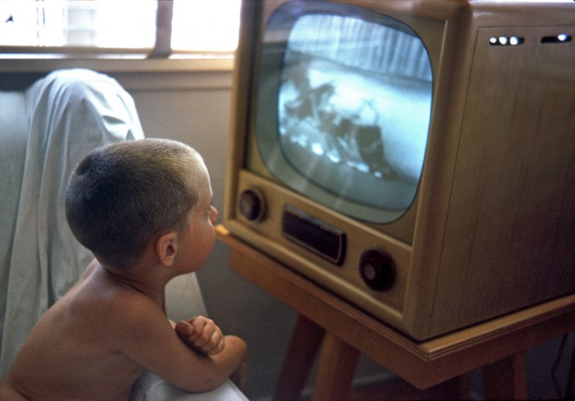 August 1963. My nephew Jimmy (who you may remember as the Suburban Cowboy) watching a cartoon on TV in South Gate, California. He's three here, and I was 17 when I shot this Kodachrome. I haven't been able to nail down the cartoon, but it has a mid-1930s look to it. View full size.
