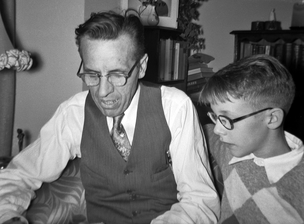 Christmas Day visits to the uncles, my mother's brothers, at their San Francisco homes was a family tradition. Uncle Frank was a noted lapidary, a pioneer in artistic and sculptural gem cutting in the U.S., author of a standard work on the subject. He was a man of many and varied interests; here at age 8, when I was at the height of my fascination with maps, I was all agog listening to him expound on the subject as we pored through the pages of an old atlas from his collection. I have similar vivid memories of being sprawled on his living room floor engrossed in the illustrations in his books on art and sculpture while all the grownups were yakking away in the dining room. Uncle Frank was, of course, my inspiration for becoming a rockhound, and supplied me with a number of exotic mineral specimens. At the time of this photo, he still had this car stowed away in his basement. 2¼-inch square Kodak Verichrome Pan negative, shot by my brother with my sister's Kodak Duaflex. View full size.