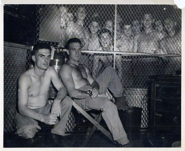 After returning to the states from the South Pacific battles in late 1944/early 1945, Dad was stationed at Parris Island where he ran the NCO Club. He was finally discharged in April 1946. This photograph was found along with some of his discharge papers. I have no clue as to who the Marines are or what is going on.  My guess is that the photograph was taken in the base brig. Could also be a bunch of new recruits. The war was over and life was good, even if this was the brig.