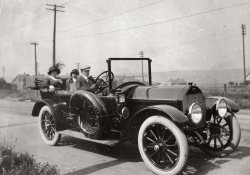 From a turn-of-the-century family photo album. Probably taken in Michigan. Can someone identify the automobile? View full size.
Sunday ExcursionI love these old family cars. Back from the times when a Sunday Drive was a leisurely thing. Our father was into Sunday Drives. Sometimes a drive to Sacramento, sometimes to Santa Cruz. Sometimes to the Santa Clara Valley to see all the acres of fruit trees in bloom. (This was in the 1940s before it became Silicon Valley.) Notice the two spare tires. Even in the 1940s a flat tire was a worry on these drives.  
Hi-res version?Dave, if you could post a higher-resolution version of the photo, I could try to identify the car.  The shape of the grille shell looks slightly familiar, but a higher-res image would help.
[There already is a hi-res version. Click above where it says "View full size." - Dave]
1909 SeldenI found it! It's a 1909 Model 29 Selden touring car; Price $2,000; cape top, $137 extra.
(ShorpyBlog, Member Gallery, Cars, Trucks, Buses)