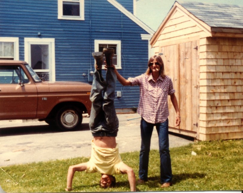 The fellow upside down is my wife's father Richard Dostie, with his sister helping him keep his balance while smoking. Taken in Rockland, ME, sometime in the early 1970's. View full size.
