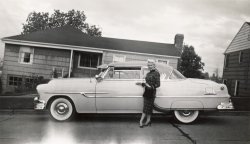 I'm sure someone will quickly tell us the make and model of the car.  The other model in the photo will probably remain a mystery, as there's nothing written on the back of this little snapshot I found at an antique fair.  View full size.
Maybe?How about a '52 Ford???
[1953 Pontiac. -tterrace]
Those were the dayswhen cars were like tanks, and women with a broken ankle could stand on their own.
IleneLove the total disregard for the angle of the houses. Just make the street straight and to hell with gravity. Shirley her name must be Ilene.
More infoTterrace is correct, it's a 53 Pontiac. More precisely, a Custom Catalina 2 door hardtop. My dad had one exactly like it. He bought it new and then sold it to my uncle two years later to buy a new 1955 Pontiac, a Star Chief 2 door hardtop. He owned the 55 until the day he died in 2011.
(ShorpyBlog, Member Gallery)