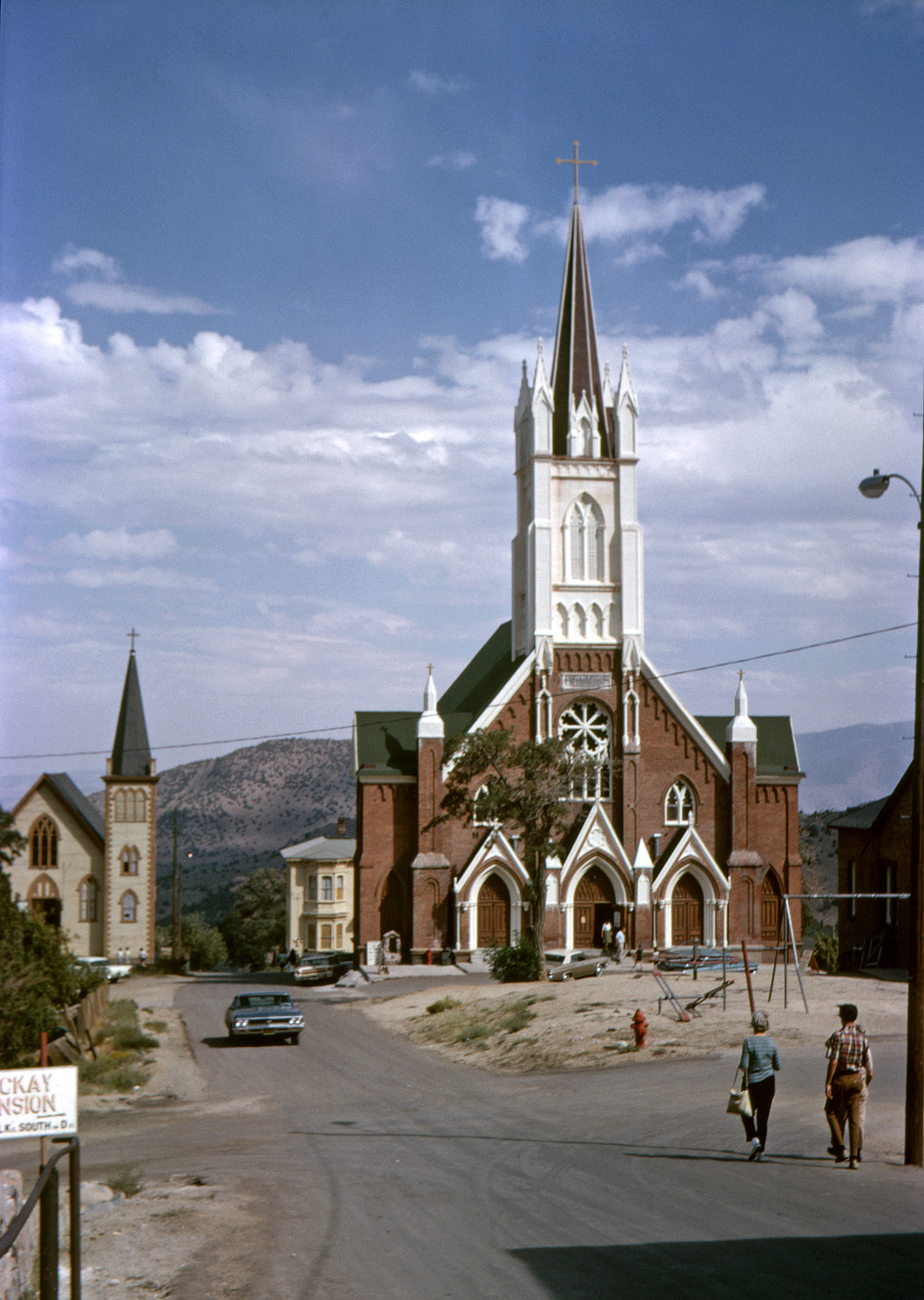 Unknowingly channeling Arthur Rothstein in Virginia City once more, I was a bit closer than he'd been to St. Mary in the Mountains Church when I took this Kodachrome slide in August 1966, and also got my mother, brother and, mostly hidden by him, my father, heading that way. I don't remember us going into the church, but another photo shows we'd parked a couple blocks down in that direction. View full size.