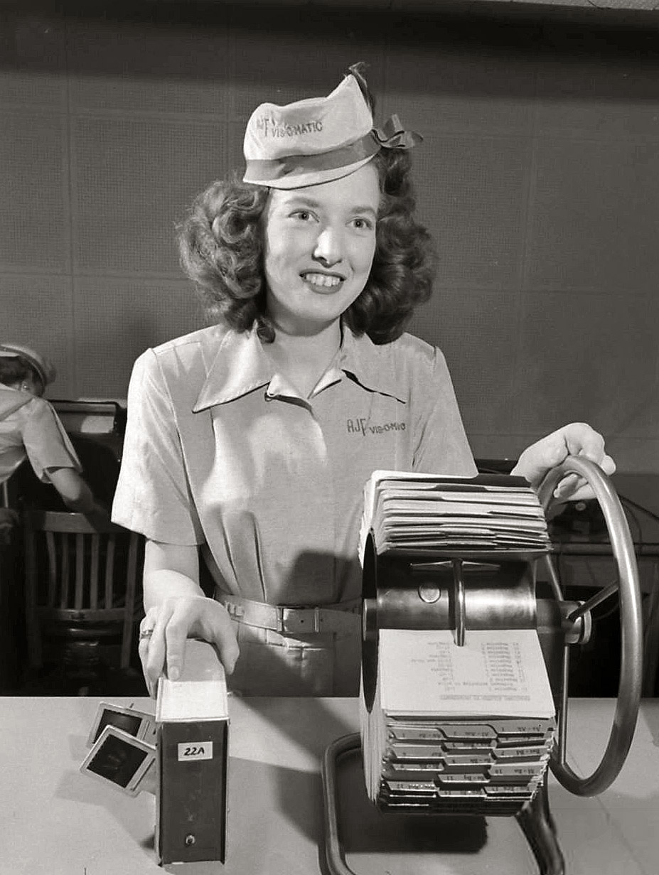 June 6, 1950. "Vis-O-Matic department store," a premonition of virtual retailing. One of at least 200 photographs taken by Bernard Hoffman at retail magnate Laurence Freiman's newfangled catalog store in Pembroke, Ontario. The cards were an index of merchandise on color slides viewed by customers on rear-projection screens. Life magazine image archive. View full size.