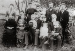 William M. and Delia Ann Burr Warner and some of their nine children. Probably taken about 1900. They lived in Broome County, New York. View full size.
(ShorpyBlog, Member Gallery)