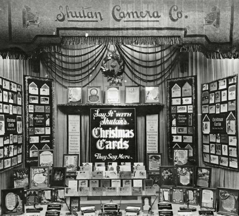 c1930s. A storefront window display of Shutan Camera Co. on West Washington Street in downtown Chicago. My grandfather Edwin Shutan offered a large selection of quality Christmas cards and fine writing instruments - and always arranged the displays meticulously. View full size.
