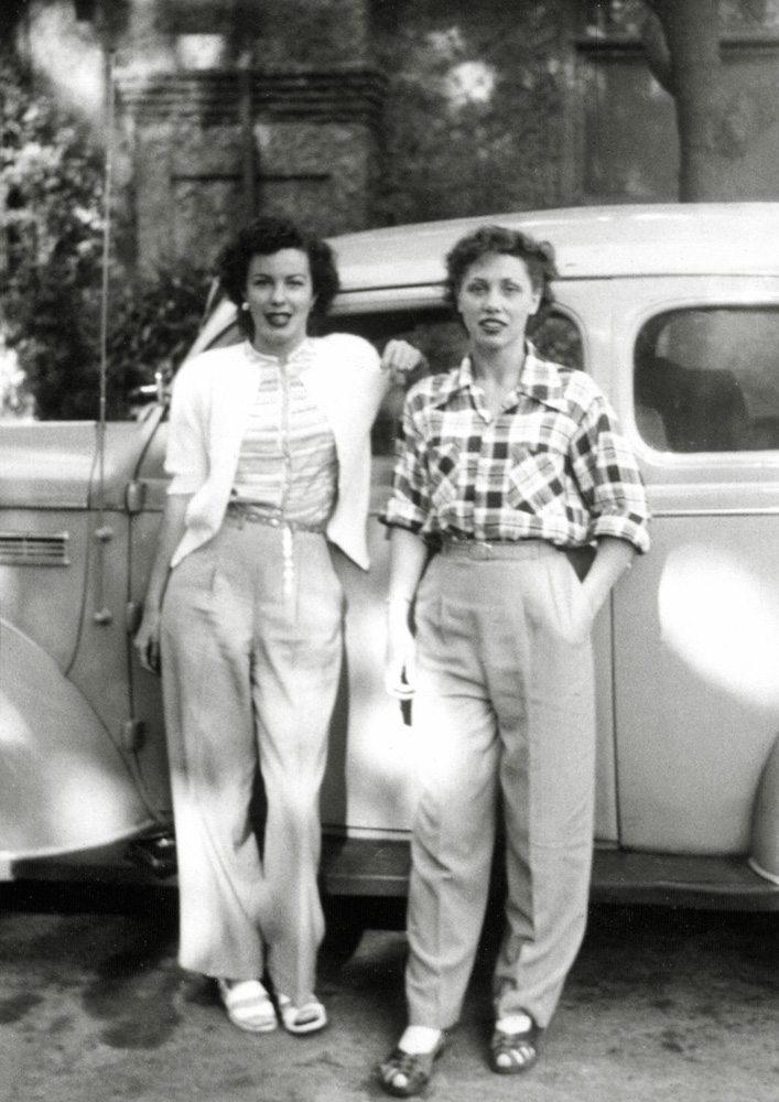 The same pair of sisters who posed with capri pants on the side of the road some years later, seem to have gotten together to have their picture snapped in front of a 1930's car. Of course they would not have called what they were wearing pants. They would have called them slacks. From an assortment of pictures I found in an antique store in Simi Valley, California. View full size.
