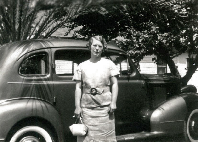 A photo of a great 1930's car with so-called suicide doors, and a somewhat impatient woman in front of them. The photo is really tiny. I suspect a contact print rather than an enlargement. And the name "Willa" is written in blue ball point pen on the top border. From an assortment of mostly car photos I bought at an antique store in Simi Valley, California. View full size.