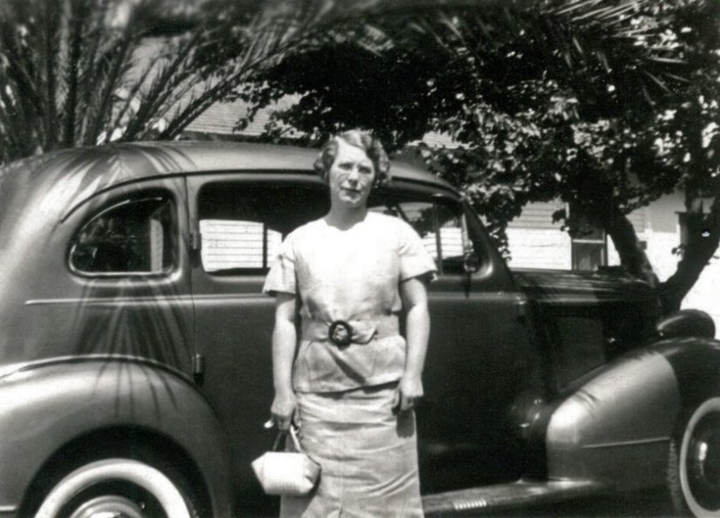 A photo of a great 1930's car with so-called suicide doors, and a somewhat impatient woman in front of them. The photo is really tiny. I suspect a contact print rather than an enlargement. And the name "Willa" is written in blue ball point pen on the top border. From an assortment of mostly car photos I bought at an antique store in Simi Valley, California. View full size.
