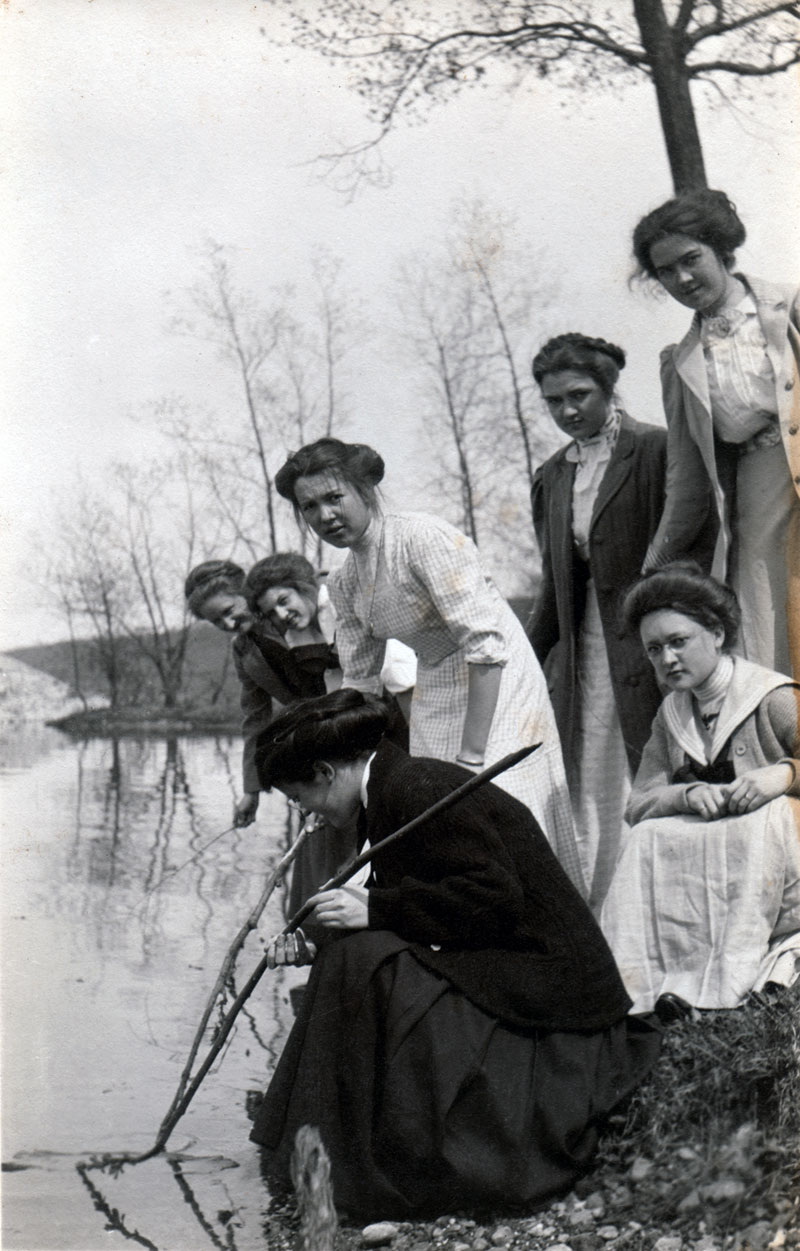 This photo makes me think of divining rods (or witching rods) that are used to find water. It strikes me that the ladies were looking for something other than water - maybe a frog to kiss, or prince charming. I hope they found what they were looking for. View full size.