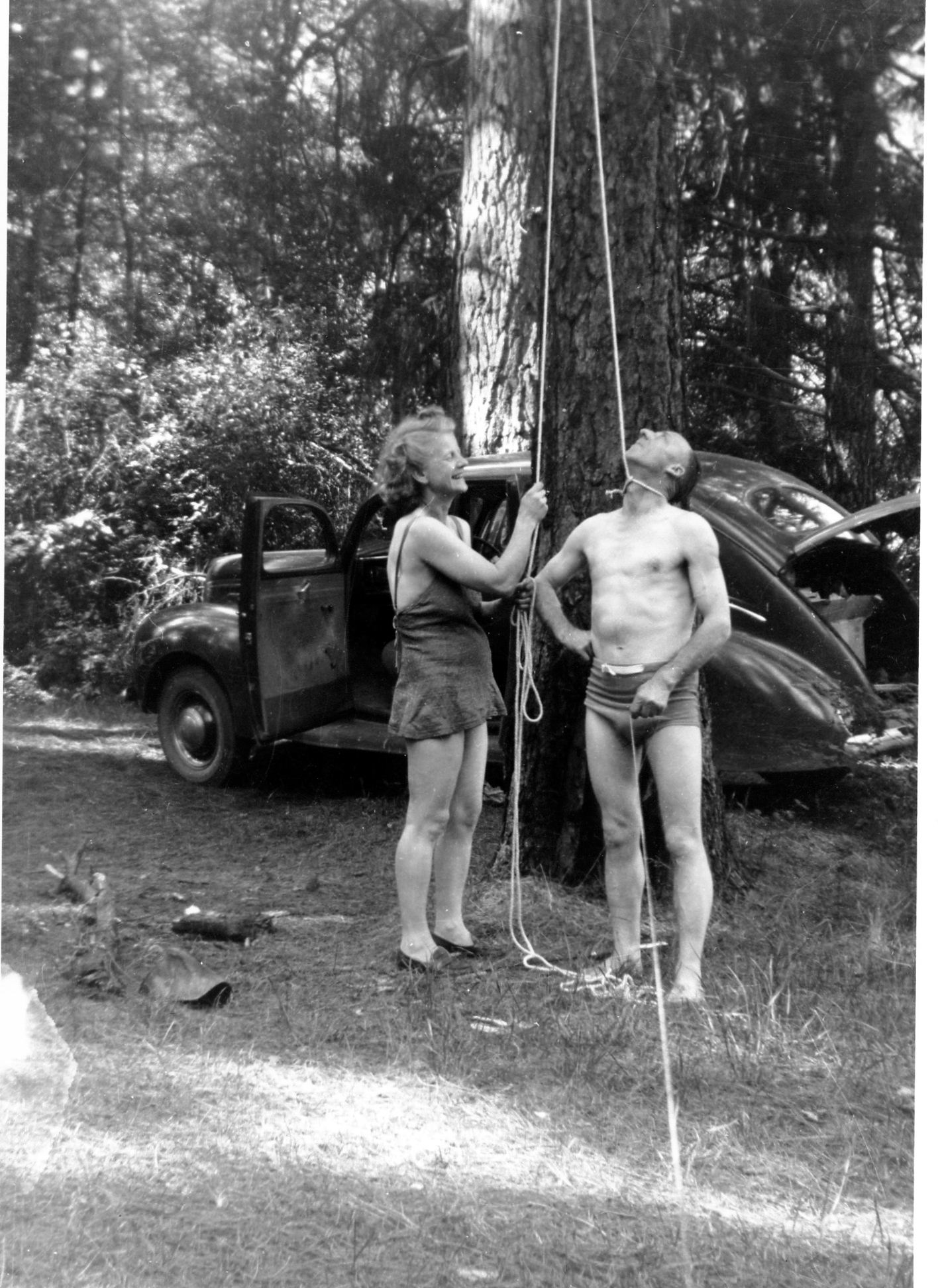 Winnie and Tom Boothby. Judging from their ages, I'd say this is the early 1940s, perhaps someone who knows cars can be more accurate than that. They went camping a lot. They are just being silly. This is probably somewhere in Oregon.