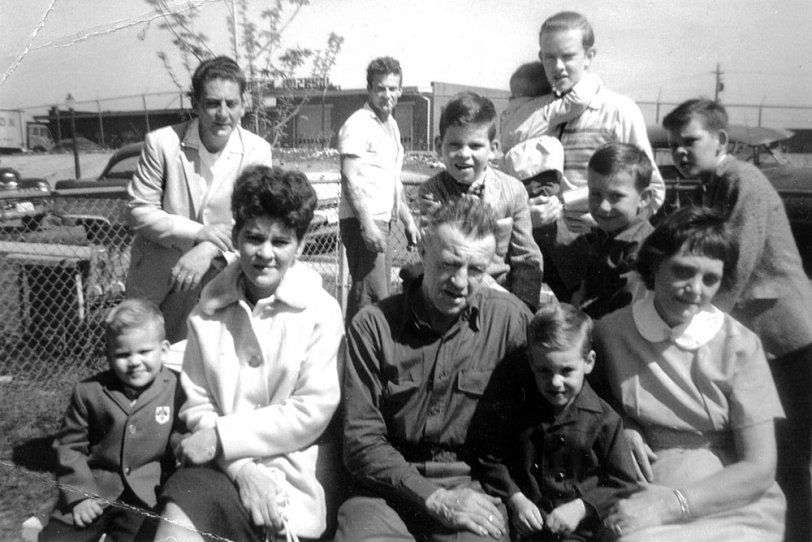 A very strange photo of a family gathering at Uncle George's (in background). I remember this day. View full size.
