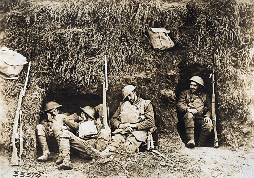 WWI American Signal Corps photo of sleeping Tommies.  Caption reads:  1st Bttn. Northampshire Infantry making best of soldeir's life in front line trenches at Molain, near Vaux - Oct. 17, 1918.
