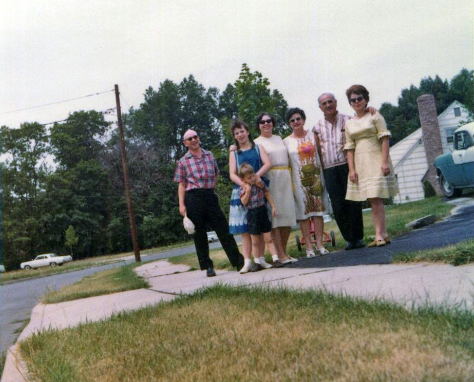 Most people would say this is a crooked picture of a family posing in front of a lawn that desperately needs watering. But it is really a picture of our 1955 Pontiac, the only used car my family ever had. When we moved from PA to NJ in 1962, my father sold our 1952 Studebaker. We took our 1960 Edsel. For some reason he thought we wouldn't need two cars. He was wrong.

So when he saw the Pontiac for sale, he bought it and brought it home, to my delight. It was a 2-door sedan with real leather seats, auto trans and radio. Some seams on those seats were coming apart. The radio did not work unless you went over a bump, then it did for 15 seconds.
It had an Indian face hood ornament that was supposed to light up, but it didn't. I loved that car, but I loved the Edsel more, so in 1967, when he said the first car to need any repair at all would be replaced, I made sure it wasn't the Edsel.

As for the people to the left of the Pontiac, they are my father Howard in the plaid shirt, my four year old brother Iden; me; my father's sister-in-law Mildred, who went by the name Margaret because she couldn't stand the name Mildred; my father's older sister Bertha, who went by the name Buddy, because she couldn't stand the name Bertha; Buddy's husband Abe, who couldn't stand me and my brother's names, so called me Princess and Iden "Johnny Boy." And my mother, Arlene who, as usual, is showing off a dress she designed and made (out of a checked fabric Abe gave her the year before). Taking the photo is my father's older brother Norman  who kept his first name, but changed his last name. View full size.