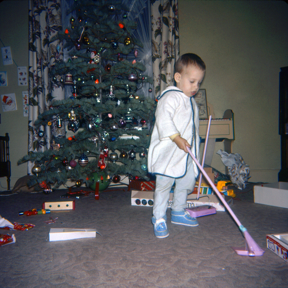 Little boys in the 60s seemed to have an obsession with floor sweeping implements, if recent Shorpy submissions are any indication. This is my nephew Jimmy, on a Christmas 1961 visit to our home in Larkspur, California. 127 Ektachrome slide.
