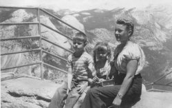 My dad, my aunt Susan and my grandmother in Yosemite, 1947. I would say they'd rather be home watching TV except they didn't own a TV until many years later. View full size.
Austrian looklooking at the hair style and blouse of your grandma, I would swear this to be Austria. Nice looking lady!
Glacier PointThis is Glacier Point overlooking the Yosemite Valley. The rock feature behind the fence pole is "North Dome". "Half Dome" would be just out of sight to the right of the picture.
(ShorpyBlog, Member Gallery)