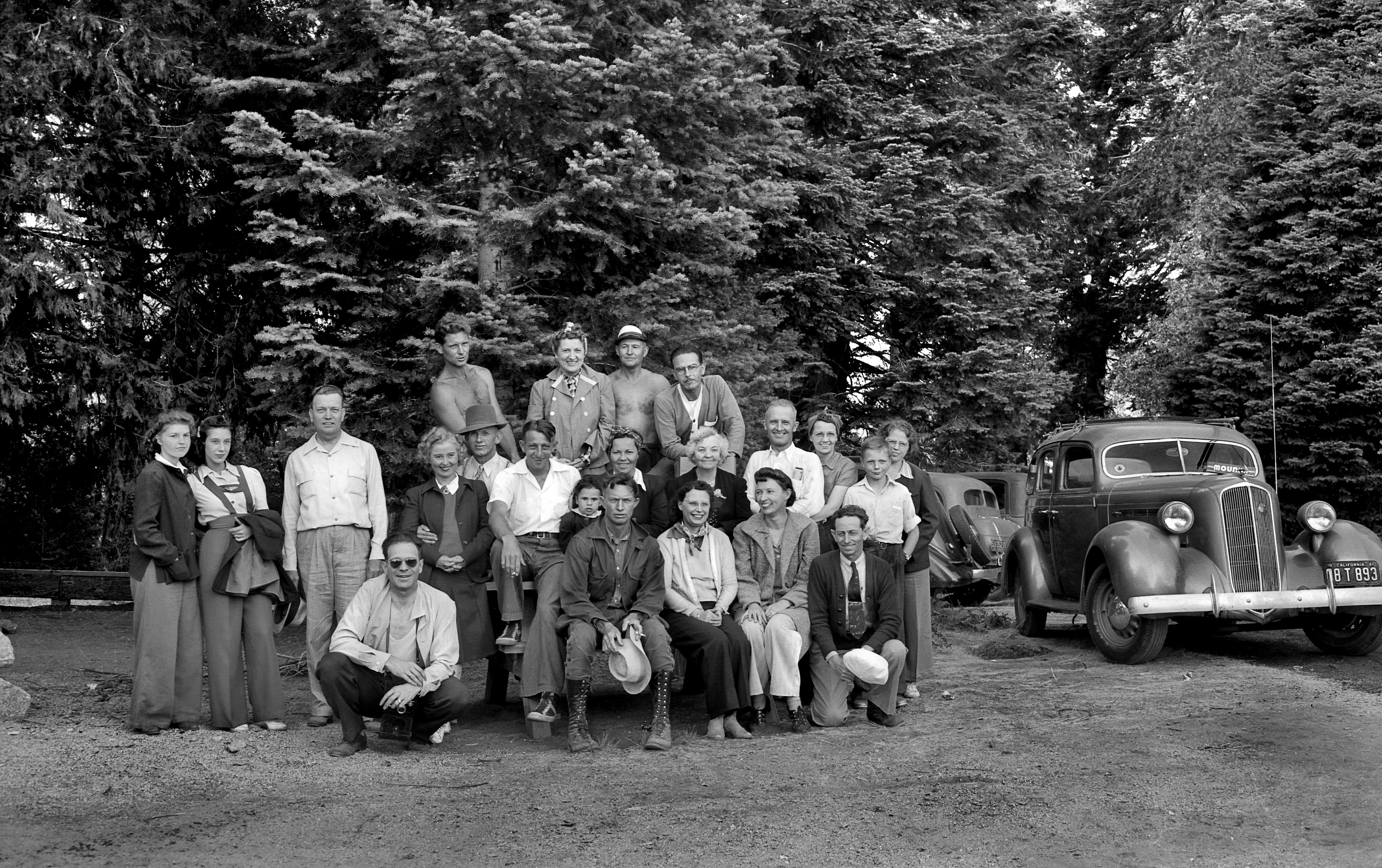 Here we see the Bliss family with friends in Yosemite. The year is 1940-41 based on the license plate to the right. The guy in the top row on the right reminds me of Richard from Boardwalk Empire. View full size.