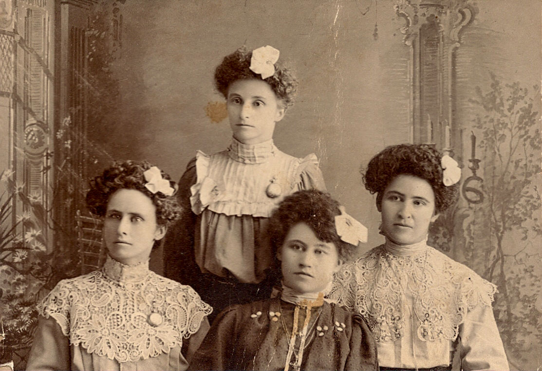 Here is a picture I came across at a thrift store of four young ladies with flowers in their hair. Sorry, I know nothing about them. It was blank on the back of the photo. I think they look like school teachers, perhaps it is a graduation of young ladies that just went to college to become teachers. View full size.